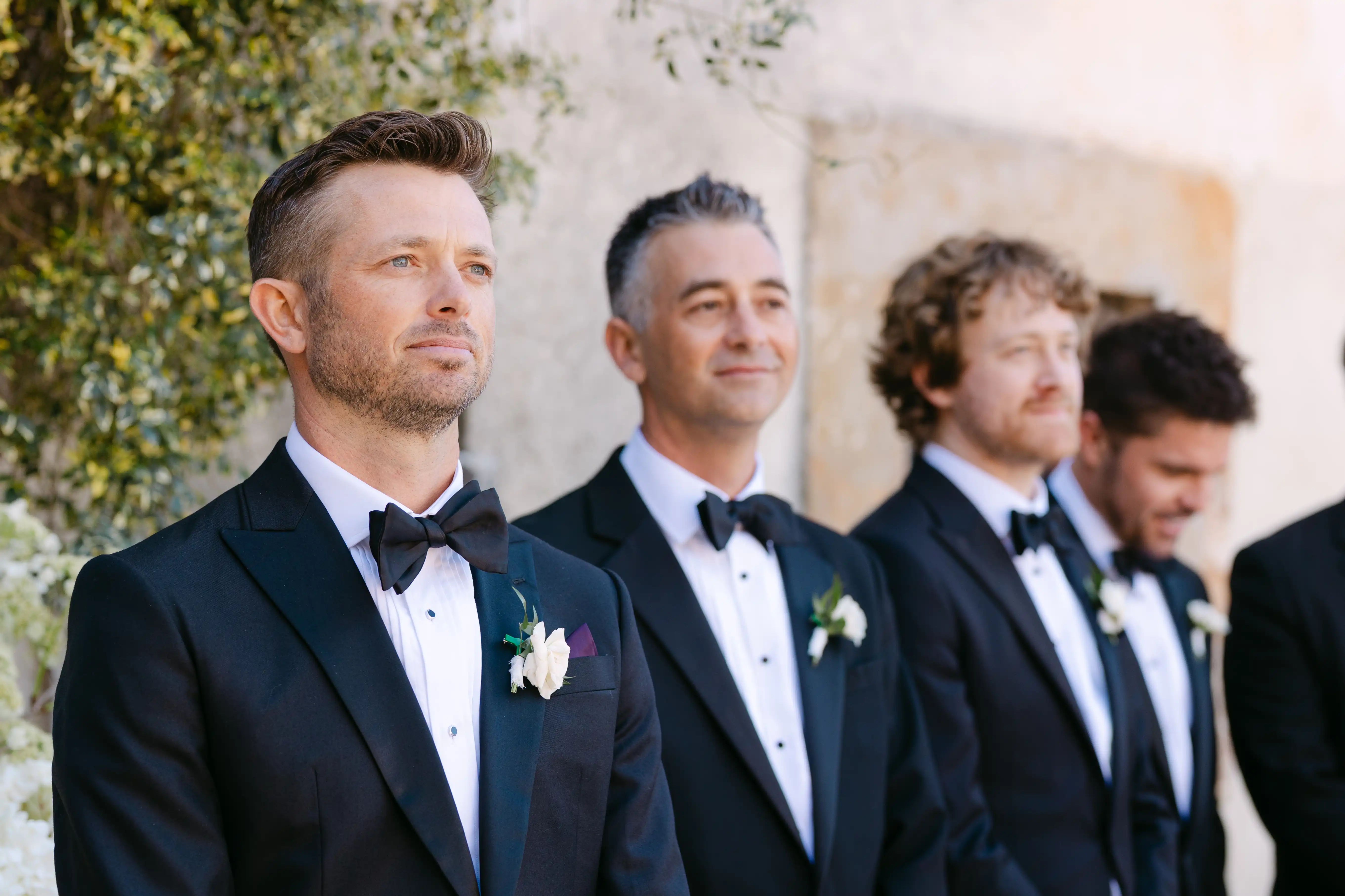 Groom waiting emotionally during outdoor destination wedding ceremony in Sicily